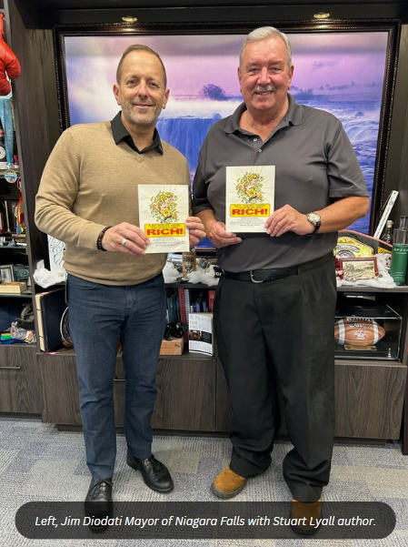 Stuart Lyall and Jim Diodati holding the book